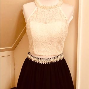 Xtraordinary 2 piece pearl white lace halter and black skirt
